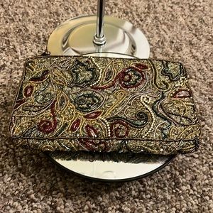 NWOT beaded pouch from Bloomingdale’s. Clean inside and out.